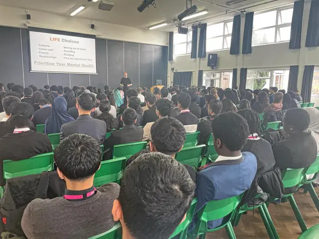 Students listening to a Simple Six presentation
