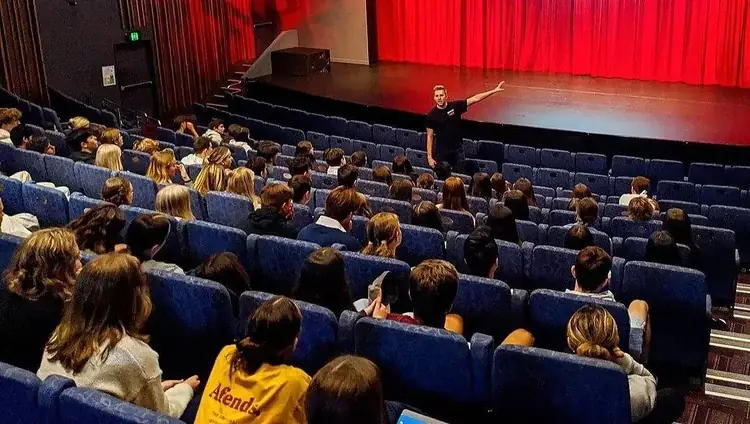 A Simple Six presentation in a school theatre